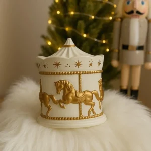 Elegant ceramic candle jar inspired by a vintage carousel, featuring gold horse figures and star details