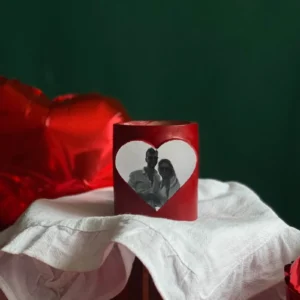 Red Valentine’s Day candle with a custom photo in a heart-shaped frame, perfect romantic gift for couples to celebrate love with a personalized touch.